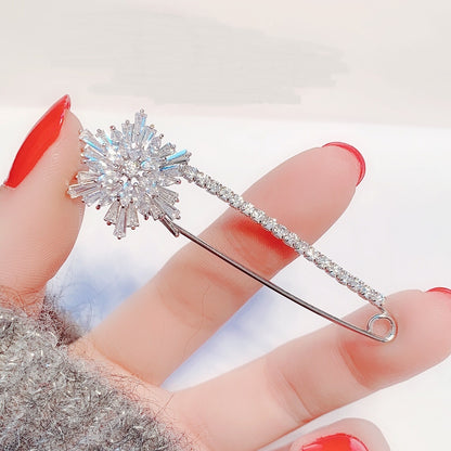 Broche Zenitha Celestial Flare: Brilla como una estrella invernal