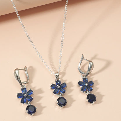 Conjunto de joyas Zenitha Sapphire Bloom: donde la gracia florece en azul