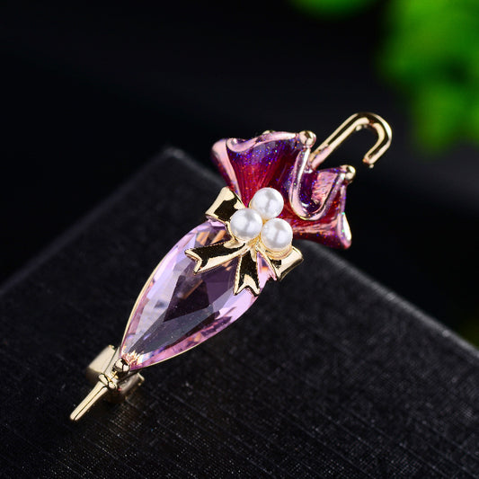 Zenitha Crystal Umbrella Brooch – Elegance with a Whimsical Twist